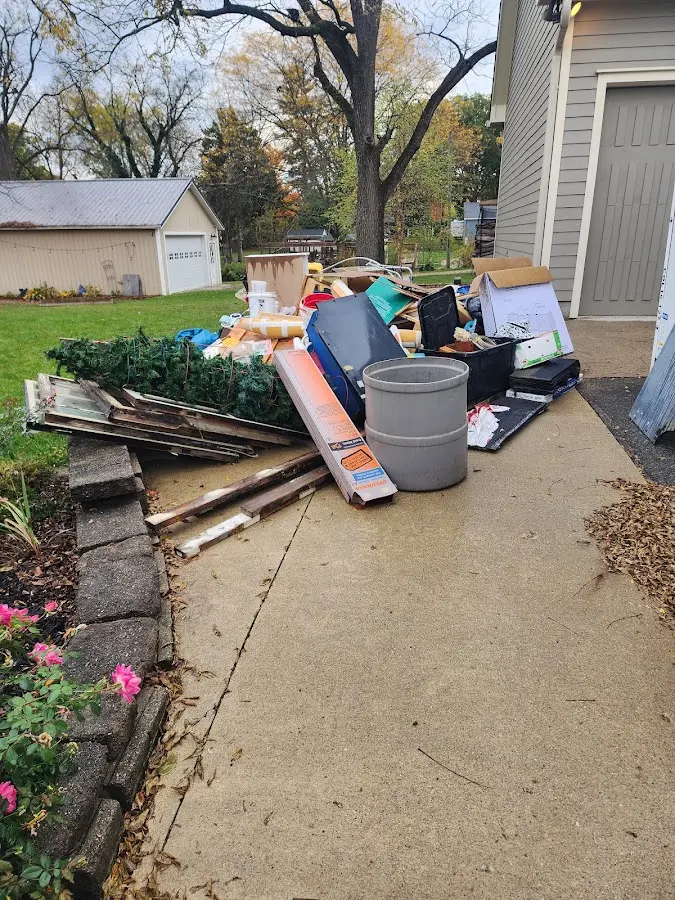 Dumpster being loaded with debris for 3 Yard Dumpster Rental in Glenpool
